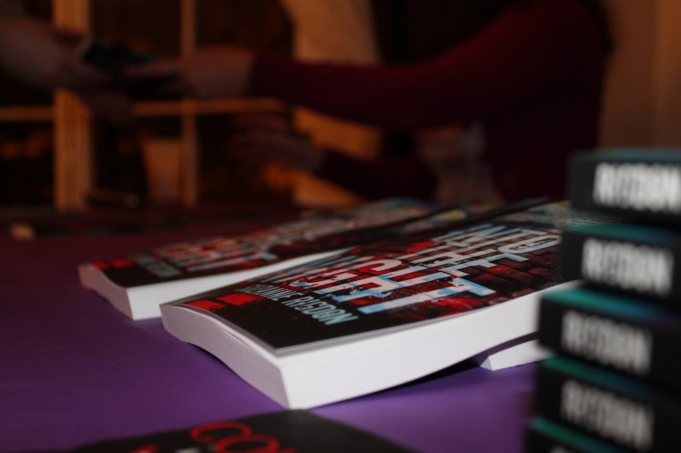 Action shot; foreground of those beautiful books!